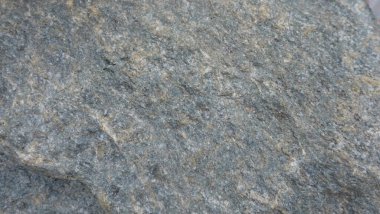 Doğal taşın dokuları ve arkaplanları çarpışıyor.