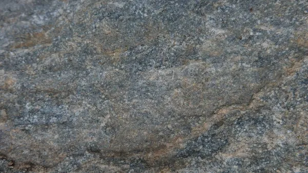 Doğal taşın dokuları ve arkaplanları çarpışıyor.