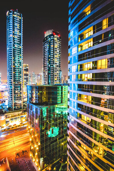 Colourful Skyscrapers At Night Cityscape View In Jumeirah Dubai, United Arab Emirates