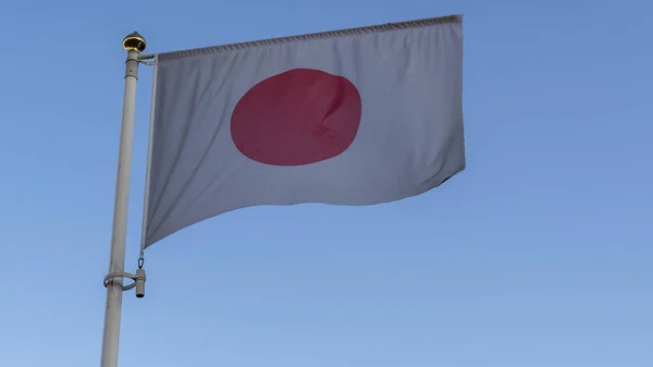 Bandera Nacional Japón Asta Bandera Frente Cielo Azul Con Rayos —  Fotos de Stock