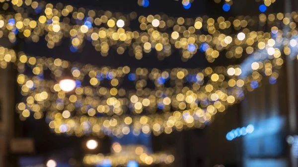 Luzes Natal Desfocadas Fronteira Guirlanda Sobre Fundo Preto Flat Lay — Fotografia de Stock