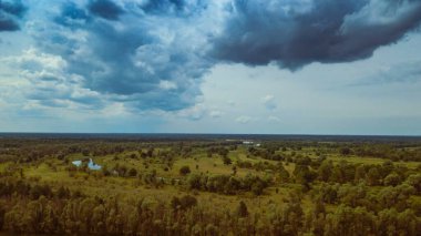 Scenic view of beautiful landscape the Belarus, Dramatic clouds in the sky. Aerial view.