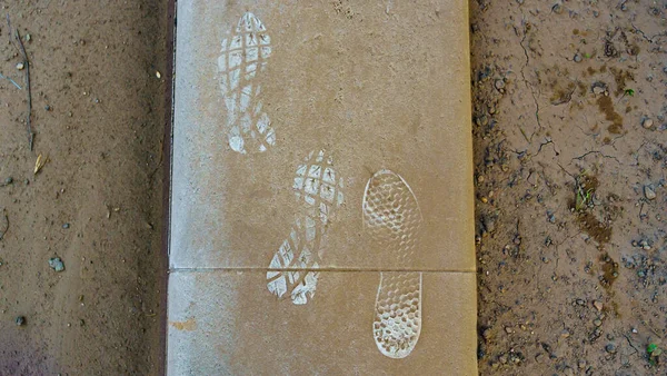 Footprints Shoes Dirty Asphalt Adventure Travel Concept Space Text — Stock Fotó