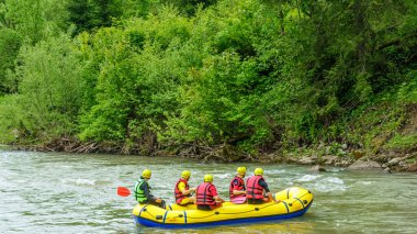 Rafting in the canyon of mountain river. Beautiful mountain river canyon - popular touristic entertainment spot. Carpathian mountains.