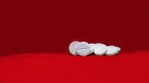 Pills Red Background White Tablets — стоковое фото