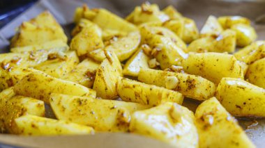 Selective focus. Raw potatoes chopped into small pieces.Chopped potato background, Space for text. Cooking concept.