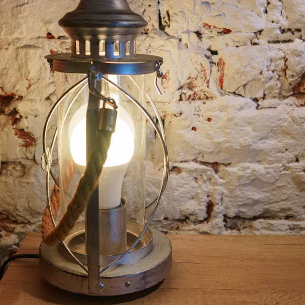 Close Vintage Table Lamp Shines White Light Brick Wall Background — Stock Photo, Image