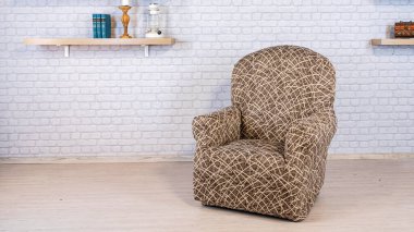 Beige armchair put on white brick wall background. Interior concept.