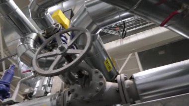 A slow motion video of steam boiler with a valve on a TPP