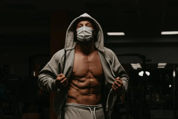 Bodybuilder Hood Face Mask Avoid Spread Coronavirus Opening Hoodie Demonstrate — Stock Photo, Image