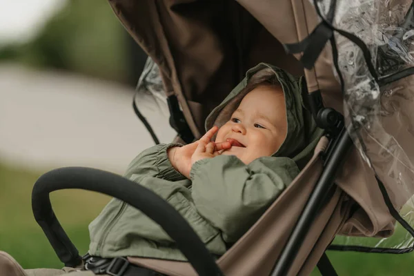 Photo Side Female Toddler Who Lying Stroller Cloudy Day Young — Φωτογραφία Αρχείου
