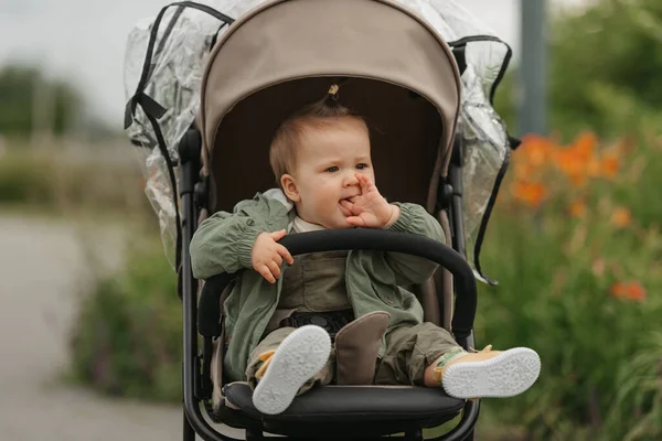 Female Toddler Putting Her Fingers Her Mouth Stroller Cloudy Day — Φωτογραφία Αρχείου