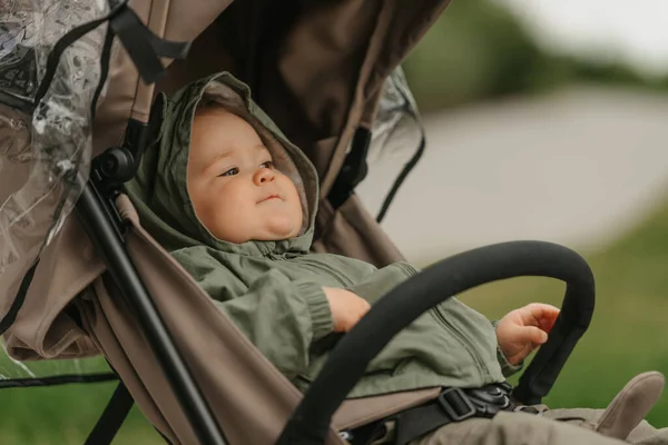 Female Toddler Lying Stroller Cloudy Day Young Girl Raincoat Her — Φωτογραφία Αρχείου