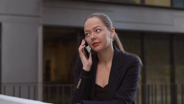 Female Realtor Calling Her Colleague While Leaning Parapet Modern Urban — Video
