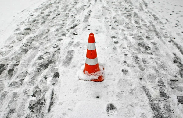 Traffic Cone Snow Surrounded Human Footprints — Stock Photo, Image