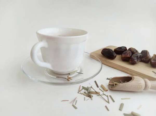 Herbal tea with dried lemongrass and dried dates — Stock Photo, Image