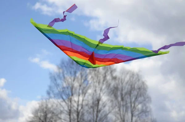 Colorful kite flying in the blue sky — Stock Photo, Image