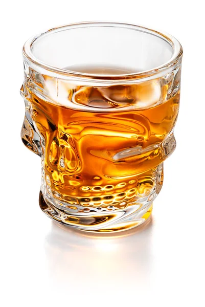 Skull Shaped Whiskey Glass Shot Isolated on White Background With Clipping Path