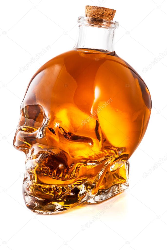 Skull Shaped Whiskey Glass Bottle Isolated on White Background With Clipping Path