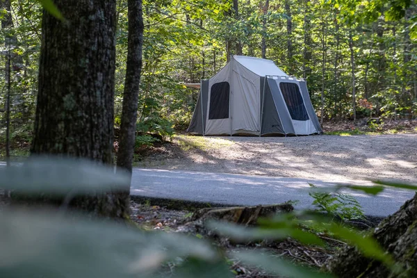 Tent set in a campground in summer during a camping trip. High quality photo