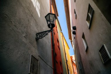 Cheb, Western Bohemia, Czech Republic, 14 August 2021: Complex of medieval colorful gothic merchant houses Spalicek at marketplace, King George of Podebrady Square, Eger, narrow picturesque street 