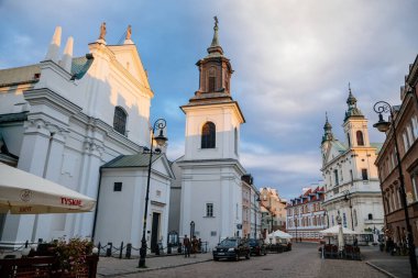 Warsaw, Poland, 13 October 2021: St. Hyacinth's Church with bell tower in New town, founded by Dominican Order and adjoins largest monastery, Renaissance and early-Baroque styles at sunny day