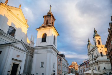 Warsaw, Poland, 13 October 2021: St. Hyacinth's Church with bell tower in New town, founded by Dominican Order and adjoins largest monastery, Renaissance and early-Baroque styles at sunny day