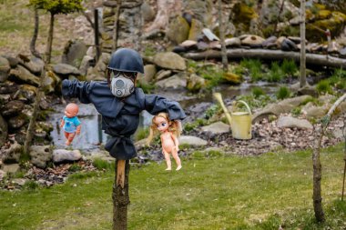 Rvacov near Hlinsko, Czech Republic, 15 April 2022: House of Hanging Dolls, terrible dirty bad plastic dolls hang on trees and on walls, Halloween and horror scary place, Abandoned and lonely toy