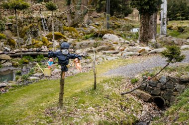 Rvacov near Hlinsko, Czech Republic, 15 April 2022: House of Hanging Dolls, terrible dirty bad plastic dolls hang on trees and on walls, Halloween and horror scary place, Abandoned and lonely toy