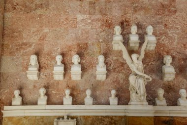 Donaustauf, Bavaria, Germany, 2 July 2022: Walhalla memorial with colonnade above Danube river, main hall of fame, inside busts of politicians, scientists and artists of German tongue, marble statues