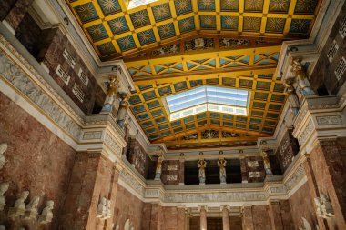 Donaustauf, Bavaria, Germany, 2 July 2022: Walhalla memorial with colonnade above Danube river, main hall of fame, inside busts of politicians, scientists and artists of German tongue, marble statues