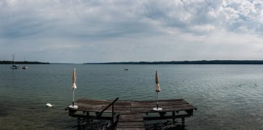 Seeshaupt, Bavaria / Germany - 08 03 2018: Small boats in the harbor of recreative lake in summer clipart