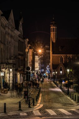 Brussels Old Town, Brussels Capital Region - Belgium - 11 30 2019 The Saint John street as taken from the Albertina square by night with cobblestones