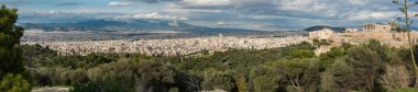 Athens Old Town, Attica, Greece - 12 28 2019 Group of hikers walking op the trail of the hills of Muses