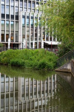 Leuven, Flemish Brabant Region, Belgium - 07 01 2022 - Luxury real estate reflecting in the water
