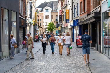 Halle, Flemish Brabant Region, Belgium,  07 02 2022 - People walking through the shopping street during summer sales