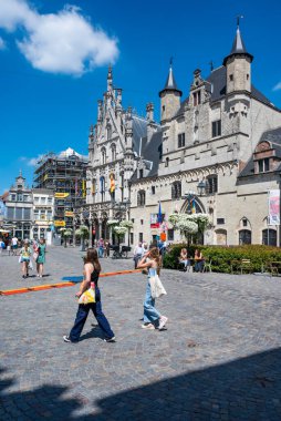 Mechelen, Antwerp Province- Belgium, 07 08 2022 - People walking at the old market square in the city center