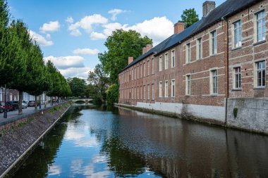 Lier, Antwerp Province, Belgium - 07 08 2022 - Historical canal in the city center with buildings reflecting in the water