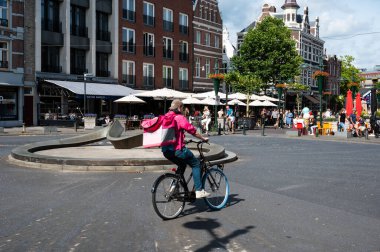 Breda, North Brabant, The Netherlands, 08 09 2022 - People in summer clothes walking at the Van Cooth square in old town