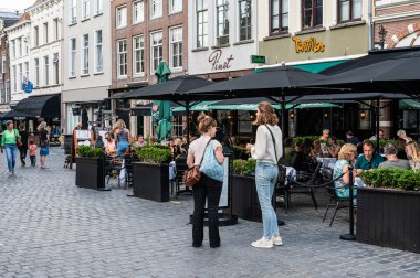 Breda, North Brabant, The Netherlands, 08 09 2022 - People enjoying the sunny terraces of old town