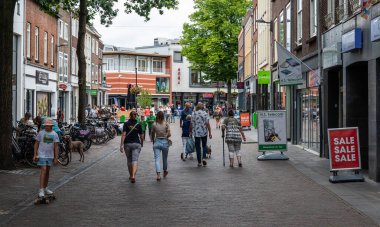 Tiel, Gelderland, The Netherlands, 07 14 2022 - People walking in the shopping streets of old town