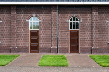 Harskamp, Gelderland, The Netherlands - 07 14 2022 - Brick stone facade of the Restored Reformed church