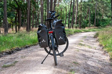 Harskamp, Gelderland, The Netherlands - 07 14 2022 - Trekking bike on a cyclist road in the Veluwe national park
