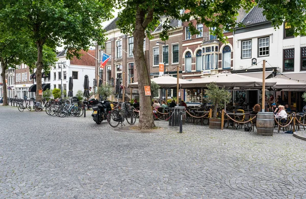 Zaltbommel, Gelderland, The Netherlands - 07 12 2022 - People sitting on sunny terraces in old town