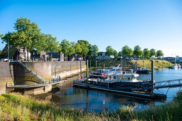 Zaltbommel, Gelderland, The Netherlands - 07 12 2022 - Small boats and yachts at the pleasure harbor against blue sky