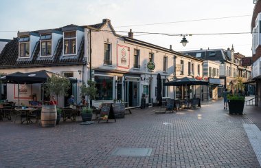 Hilversum, North Holland, The Netherlands, 07 21 2022 - People walking and driving the bike in the city center
