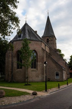 Diever, Drenthe, The Netherlands, 07 15 2022 - Facade and tower of the local church