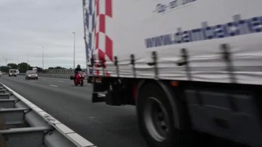 Zaltbommel, Gelderland, The Netherlands - 07 12 2022 - Busy traffic with cars and trucks over the A2 highway