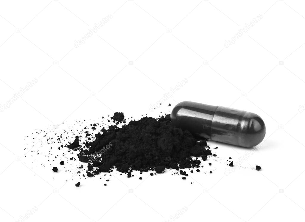 Charcoal capsules and powder isolated on white background.
