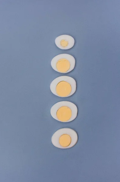 Sliced Boiled Egg Egg Yolk White Blue Background Minimalistic Photo — Stock Photo, Image